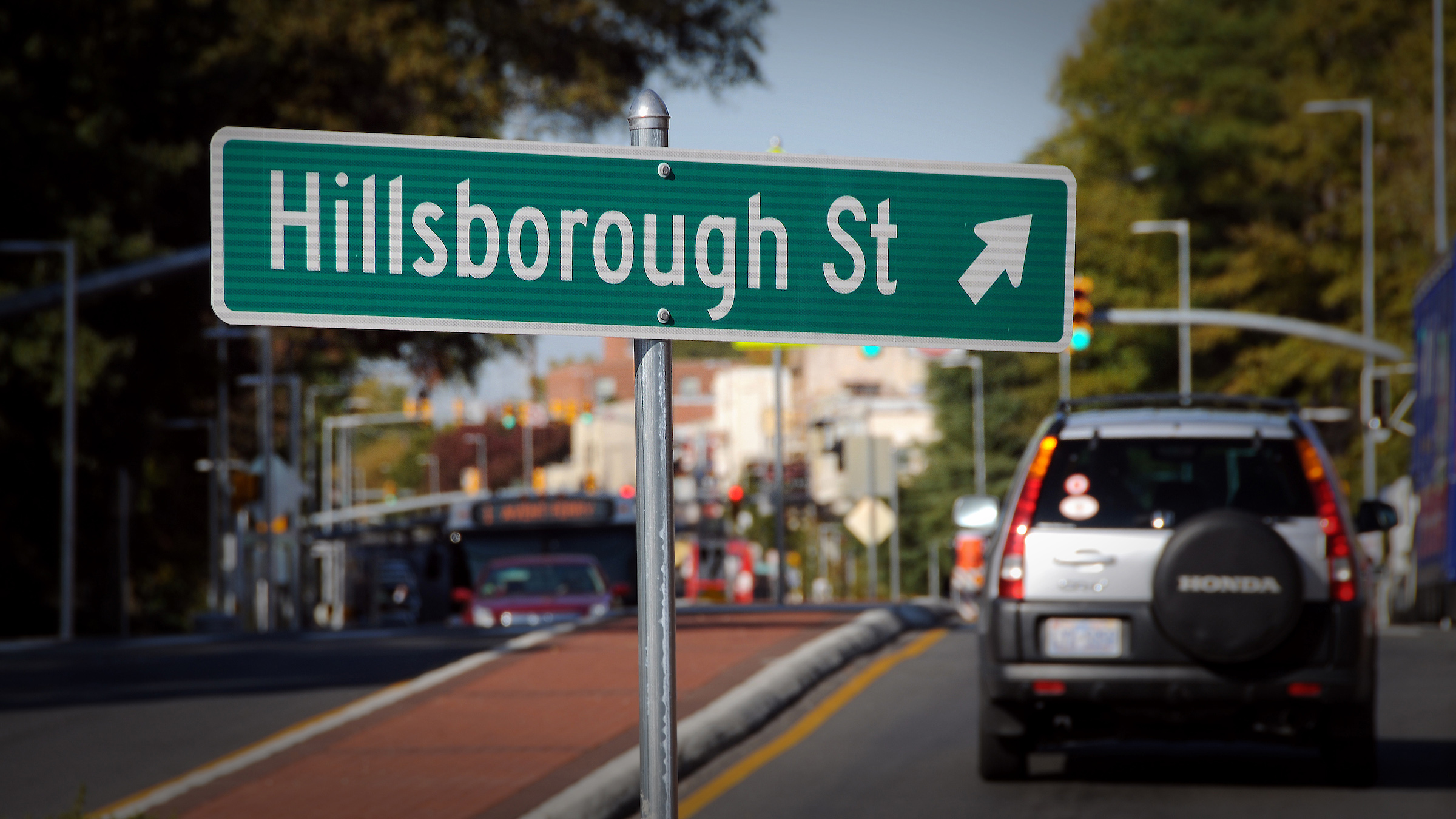 Sign points the way up Hillsborough Street towards campus.