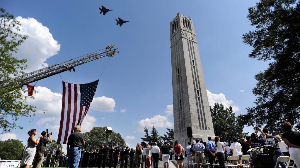 F15E fighter jets streak past the Belltower in this photo composite to conclude the September 11th memorial service on campus.