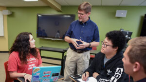 IEP students talking with instructor Billy Haselton during class.